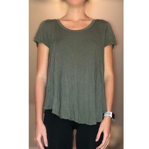 Green shirt with a cut out circle in back